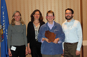 Photo of Robin Squier accepting her award